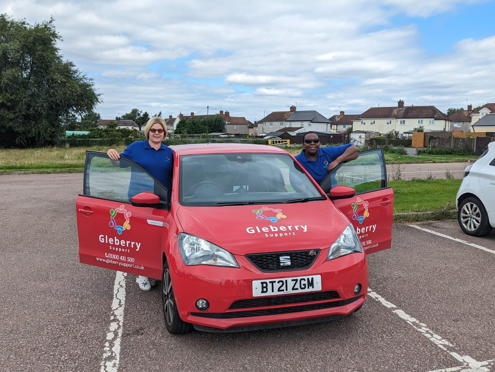 Gleberry Support team with branded red car