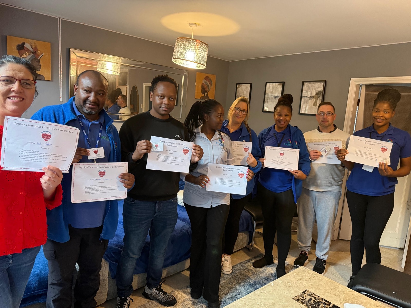 Gleberry Support team holding certificates of commitment